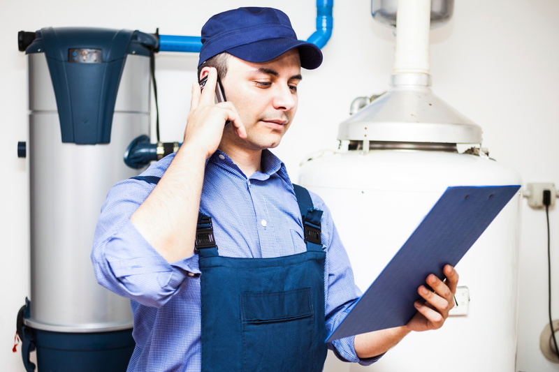 Technician servicing an hot-water heater