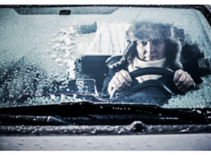 Image of a person sitting in a frozen car